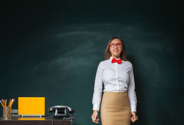 istock Young woman in front of blackboard 638865108
