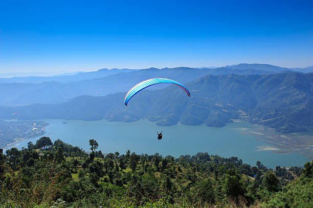 istock paraglider preparing to launch itself in the air. 638867780