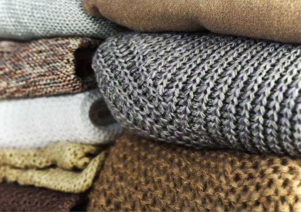 istock two stacks of warm sweaters on a full background horizontal 638869670