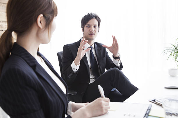 istock Businessman seriously talking about business women 638870184