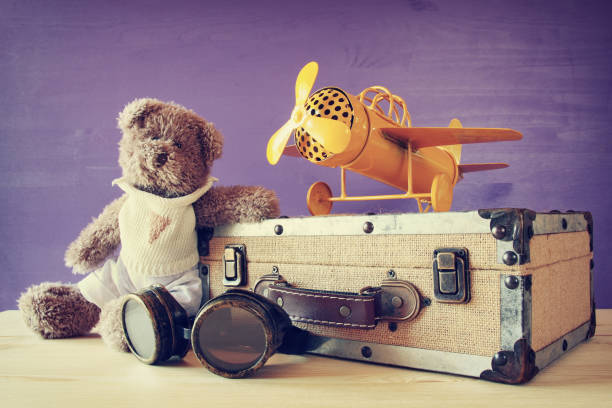 istock vintage toy plane and cute teddy bear 638870778