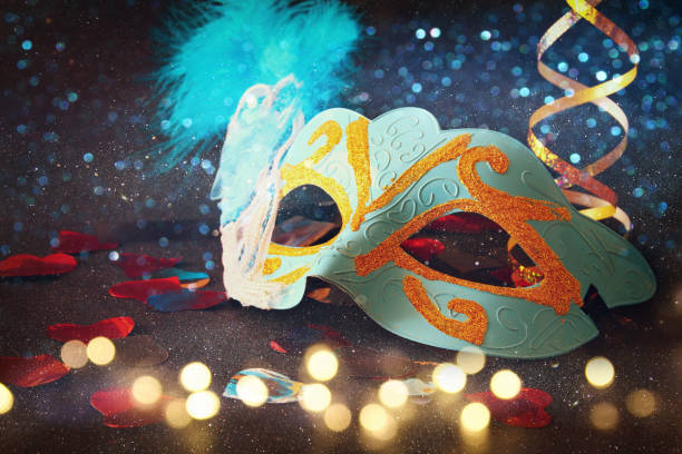 istock elegant venetian, mardi gras mask on glitter background 638873188