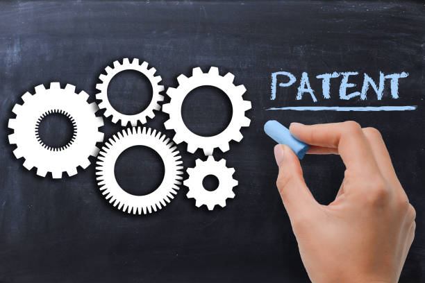 istock Industrial patent protection concept with gears on blackboard 638873856