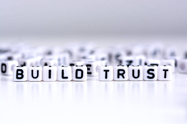 istock Build trust process concept with tiled letters on white background 638874098
