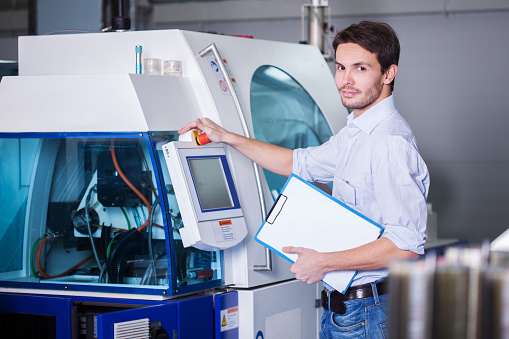 Man entering  code on the machine control panel