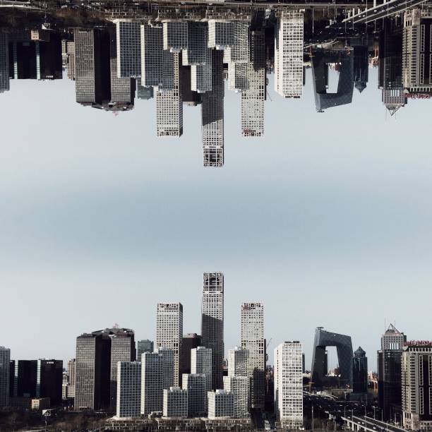 China, Beijing City, Guomao District, Urban skyline with China Central Television Headquarters upside down