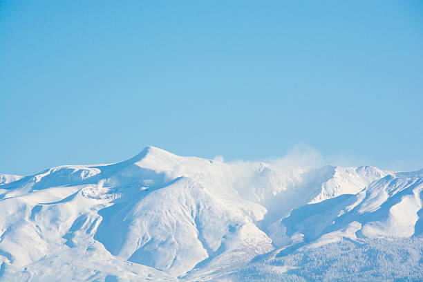 istock Blue sky and summit of winter mountain 638875876