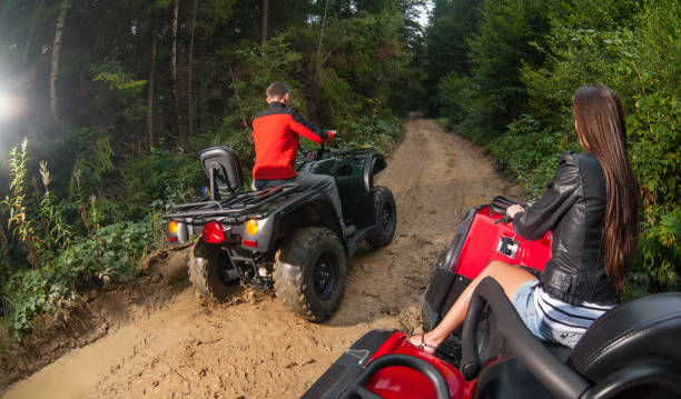 istock Couple driving four-wheelers ATV offroad 638876486
