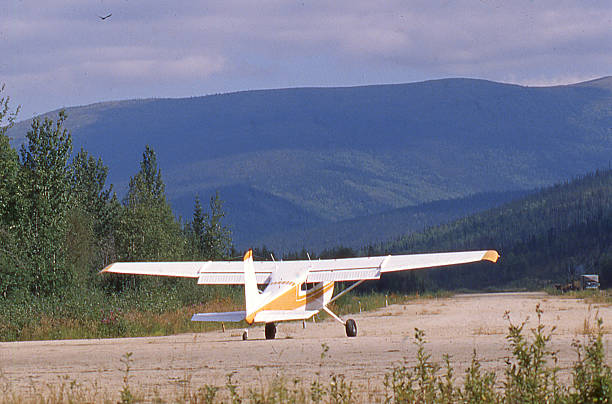 istock Bush pilot small airplane taking off dirt airstrip interior Alaska 638877928
