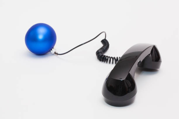 istock Old phone reciever and cord connection with Christmas decoration 638879192