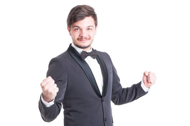 istock Handsome man wearing tuxedo and bowtie making success gesture 638880210
