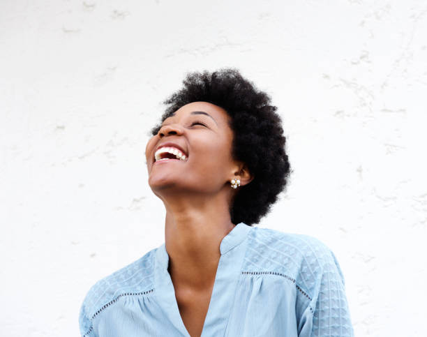 istock Young black woman looking away and laughing 638882860