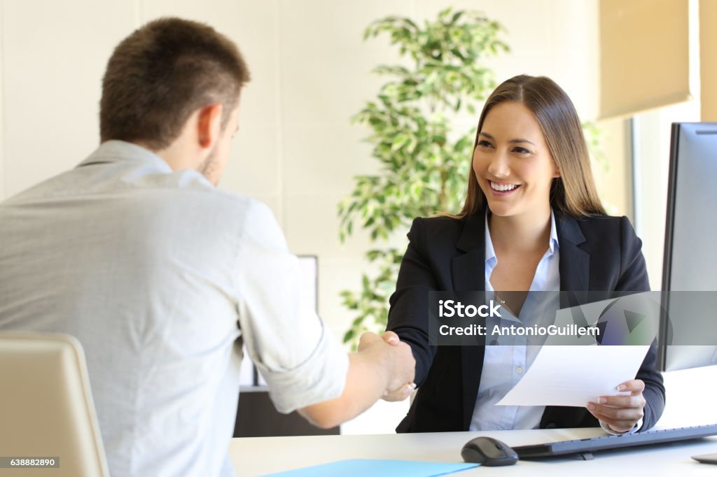 Successful job interview Successful job interview with boss and employee handshaking Job Interview Stock Photo