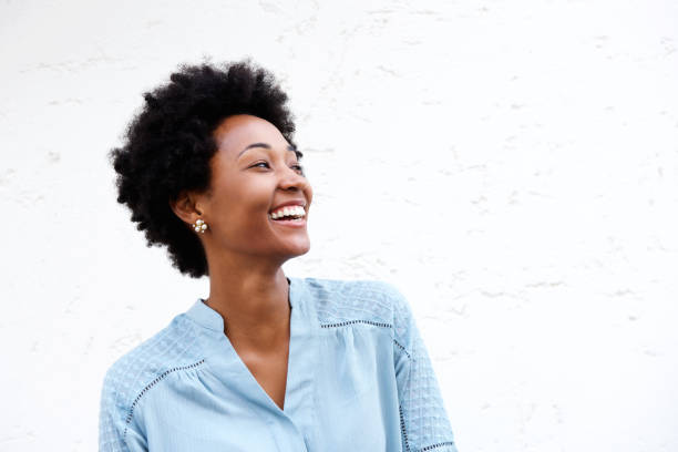 istock Beautiful young black woman looking away and smiling 638883480