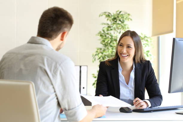 man giving curriculum in a job interview - employ imagens e fotografias de stock