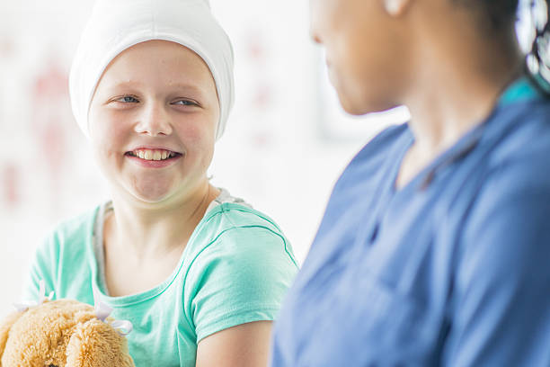 istock Nurse Talking to a Child with Cancer 638883910