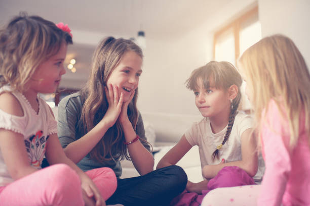 istock Four girls sitting on the floor. 638885152