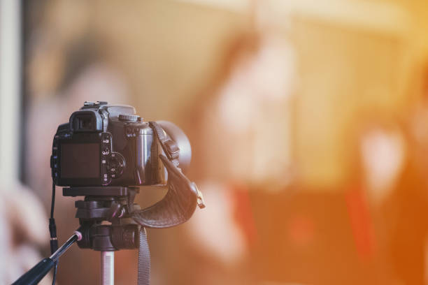 camera on a tripod indoor with beautiful blured background - tripod imagens e fotografias de stock