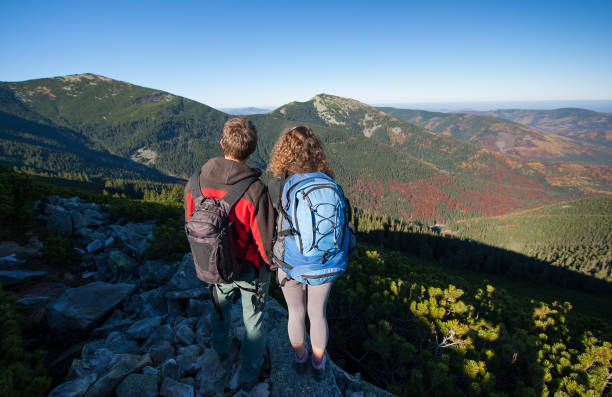 istock Young backpackers couple enjoying beautiful landscape 638886254