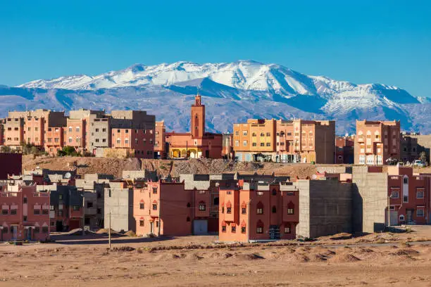 Ouarzazate city and High Atlas Mountains aerial panoramic view, Morocco. Ouarzazate is a city and capital of Ouarzazate Province in Morocco.