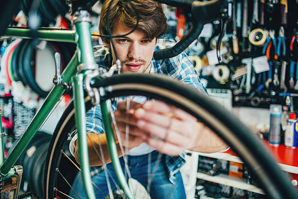 istock Mechanic repairing a bike 638886478