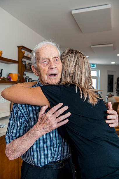 istock Senior Man Receiving a Hug from a Caregiver 638886694