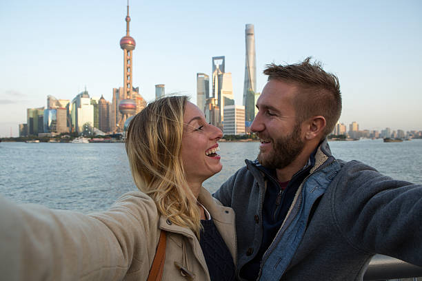 istock Young couple taking selfie in Shanghai 638886940