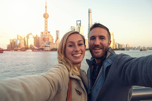 istock Young couple taking selfie in Shanghai 638887736
