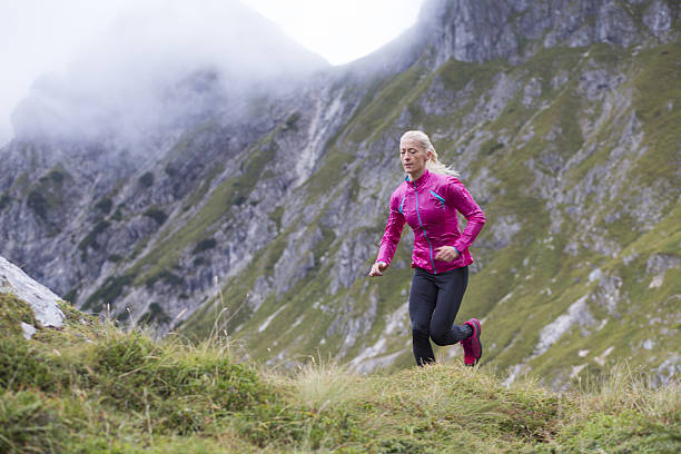 istock Woman running on mountain 638889870