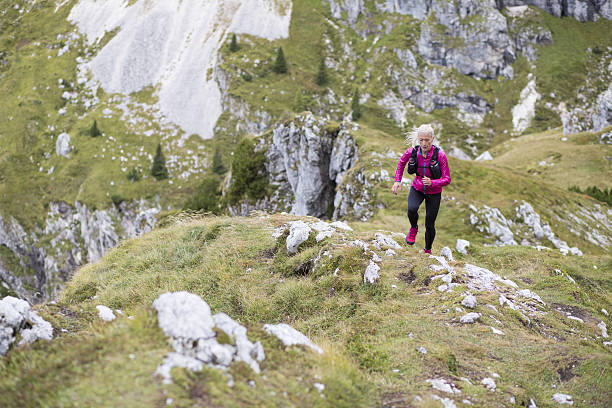 istock Woman running on mountain 638889944