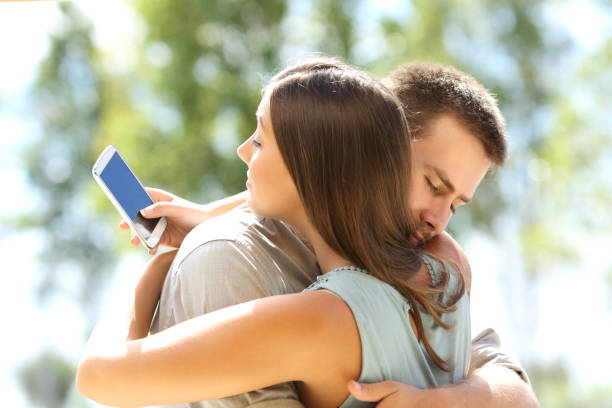 istock Girlfriend cheating and hugging her boyfriend 638890038