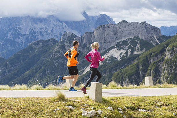 istock Couple running on road 638890758