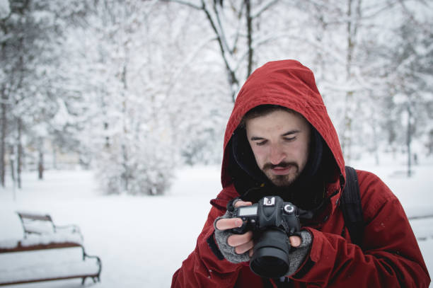 istock Photographer looking pictures in the snow 638891268