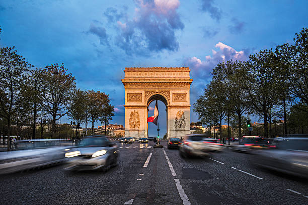 istock Cars moving on road at Arc de Triomphe against sky 638891422
