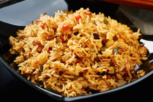 istock Close-up of Rice with vegetables on black square plate 638892648