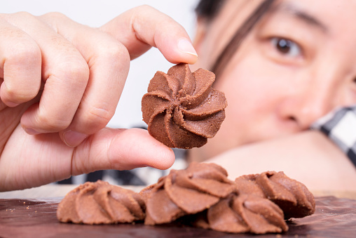 girl making homemade chocolate cookies