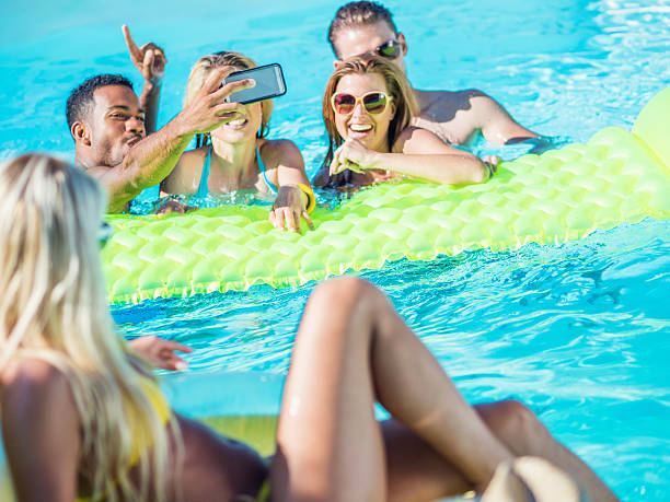 istock Friends enjoying pool party 638892782