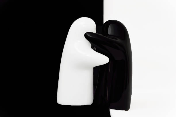 istock Black and white porcelain figurines on a white/black background 638893584