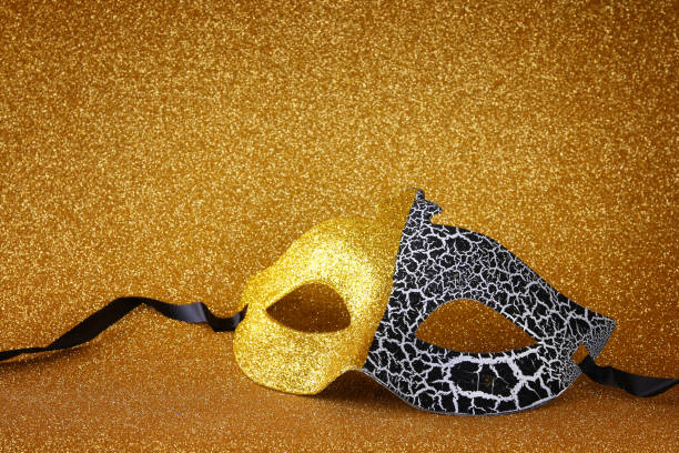istock elegant venetian mask on gold glitter background 638894438