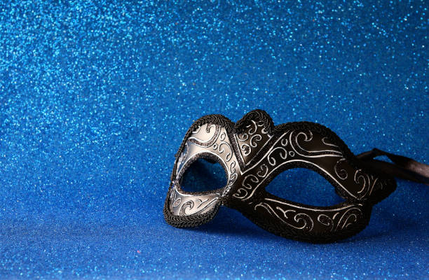 istock elegant venetian mask on blue glitter background 638894514