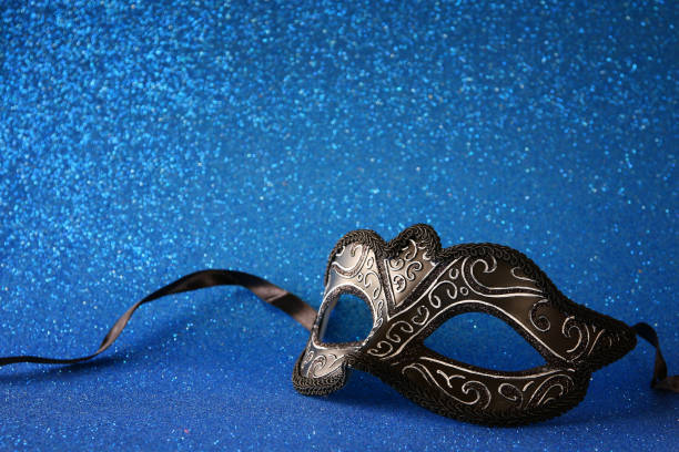 istock elegant venetian mask on blue glitter background 638894660