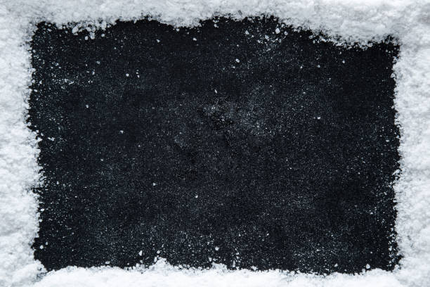 istock Sea salt grains frame on the black background. 638895214