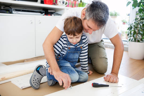 istock Father and son assembling furniture 638895980