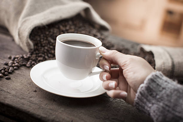 istock Hand holding cup of coffee 638897678