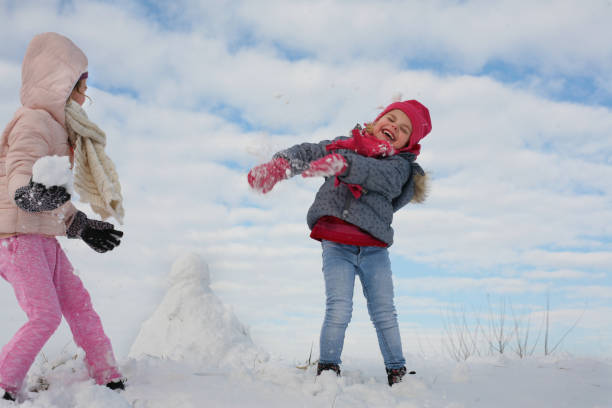istock Two cute grill in the snow. 638897690
