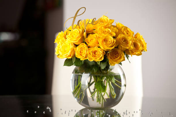 istock Yellow roses in vase on the table. 638898326