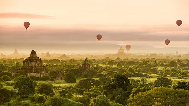 Hot air balloons dot the morning sky in Bagan, Myanmar