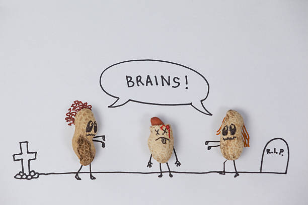 istock Zombie  figurines getting tempted towards the broken head figurine 638900582