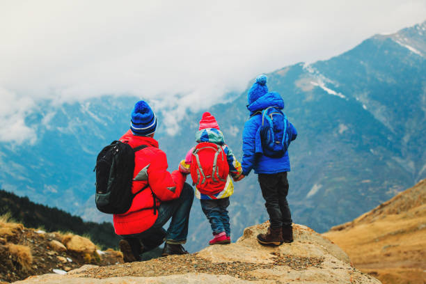 istock father with two kids travel in scenic mountains 638900954