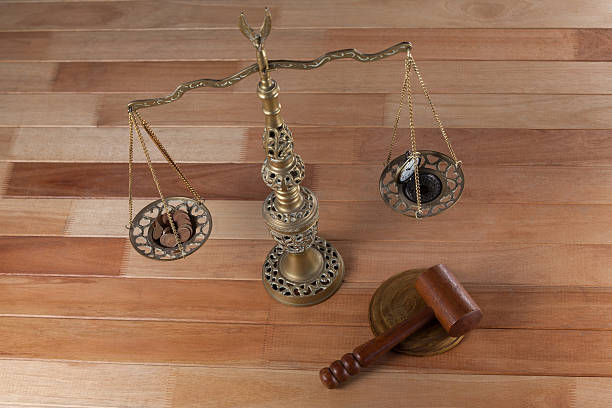 istock Conceptual image of watch and coins on the justice scale 638901308